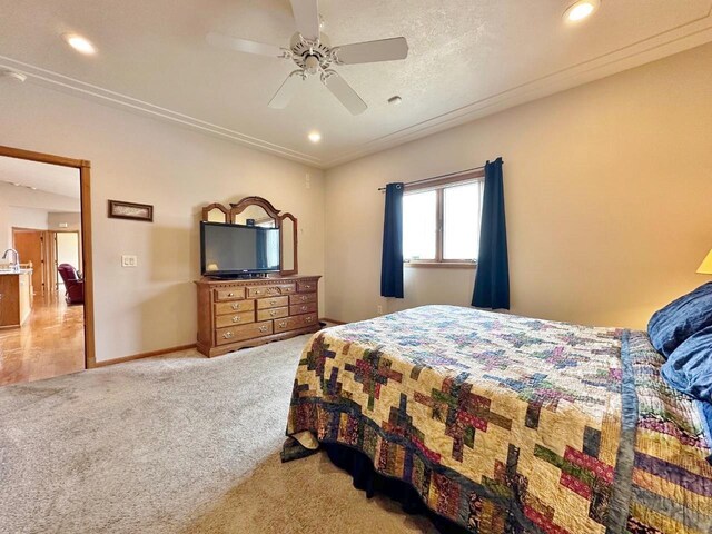 bedroom with baseboards, recessed lighting, a ceiling fan, and light colored carpet