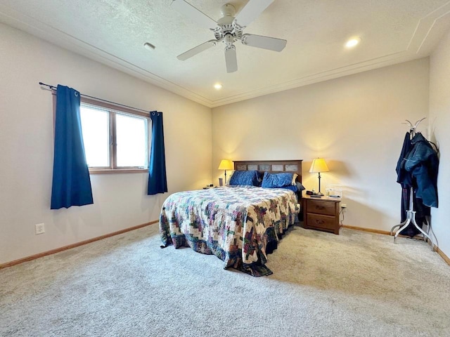 carpeted bedroom with a ceiling fan and baseboards