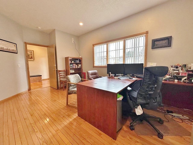 home office with recessed lighting and light wood-style floors