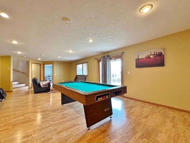 rec room with recessed lighting, a textured ceiling, light wood-style flooring, and pool table
