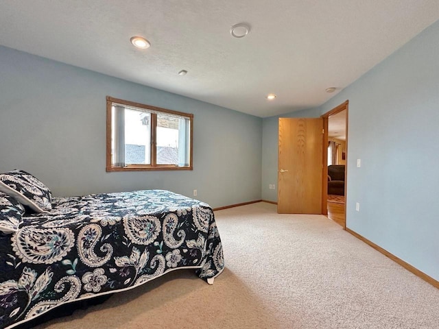 bedroom featuring baseboards, recessed lighting, and carpet floors