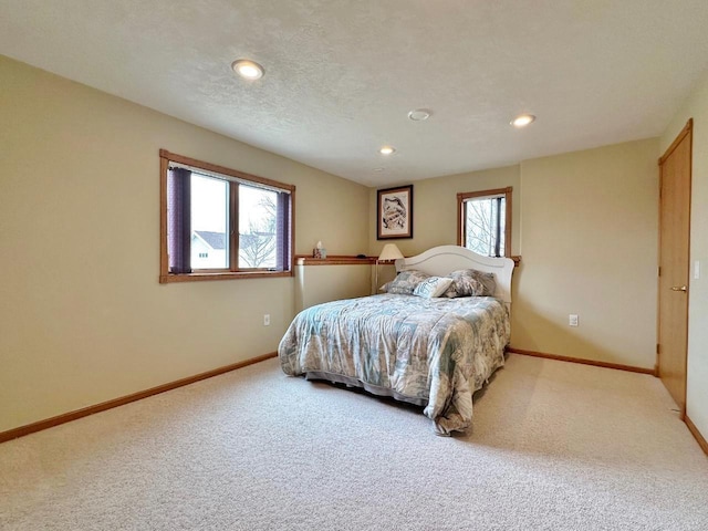 carpeted bedroom with recessed lighting and baseboards