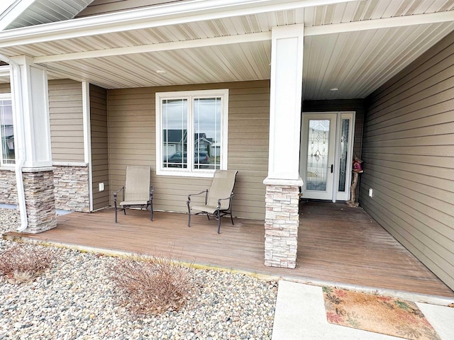 doorway to property featuring stone siding