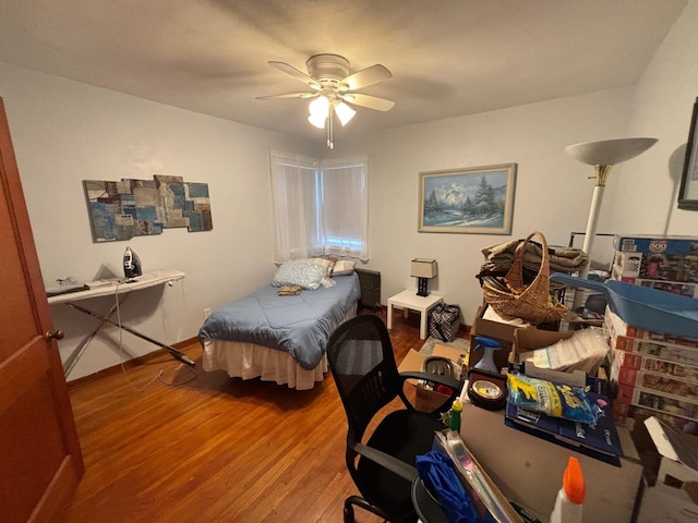 402 Brewster St, Harvey, ND 58341 - bedroom featuring wood finished floors and ceiling fan