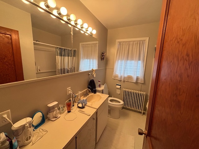 402 Brewster St, Harvey, ND 58341 - full bathroom featuring tile patterned floors, a shower with curtain, radiator, toilet, and vanity