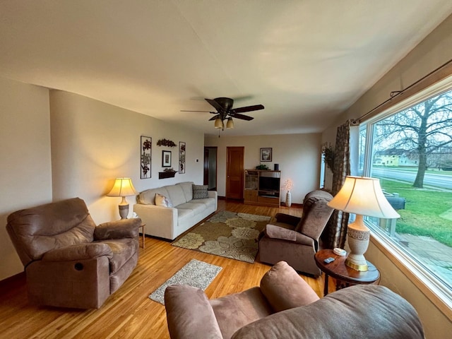 402 Brewster St, Harvey, ND 58341 - living area featuring wood finished floors and a ceiling fan
