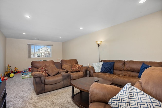 living area with carpet and recessed lighting