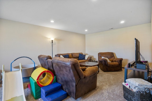 carpeted living room featuring recessed lighting