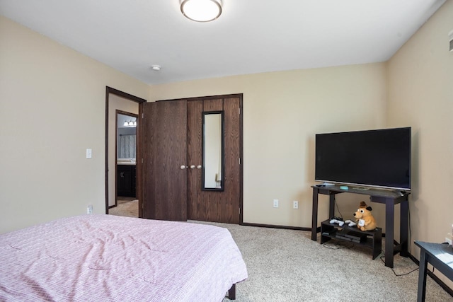 bedroom featuring baseboards and light carpet