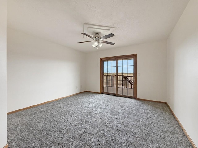 spare room with carpet flooring, ceiling fan, and baseboards