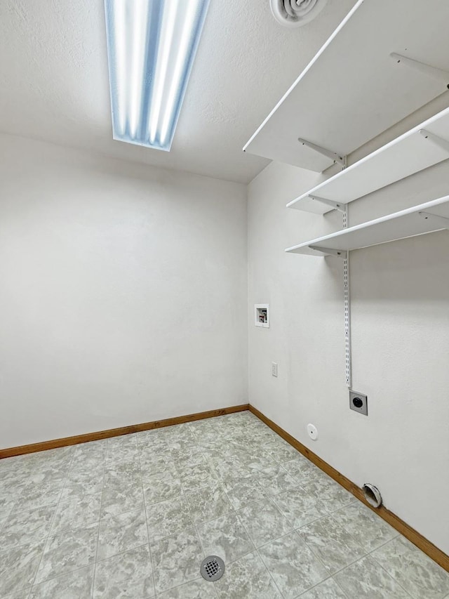 laundry room with laundry area, washer hookup, gas dryer hookup, baseboards, and hookup for an electric dryer