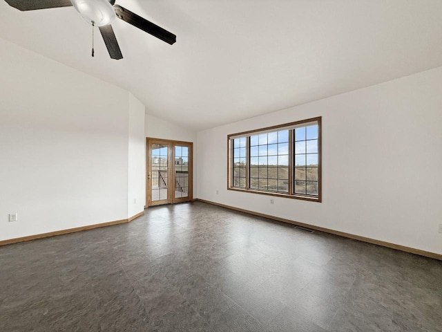 spare room featuring ceiling fan, french doors, visible vents, baseboards, and lofted ceiling