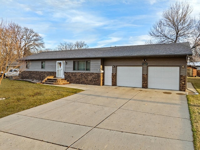 15 Oak Dr, Minot, ND 58701 - ranch-style home featuring a shingled roof, a front lawn, brick siding, a garage, and concrete driveway