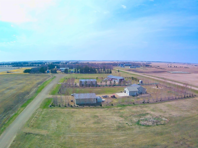 birds eye view of property with a rural view