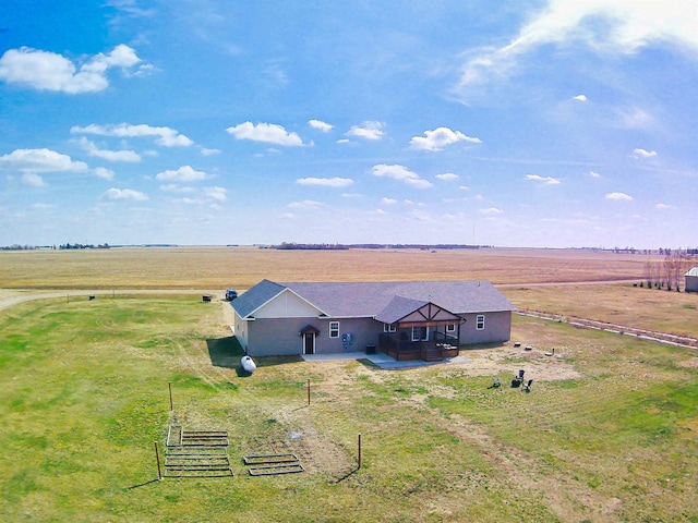 birds eye view of property featuring a rural view