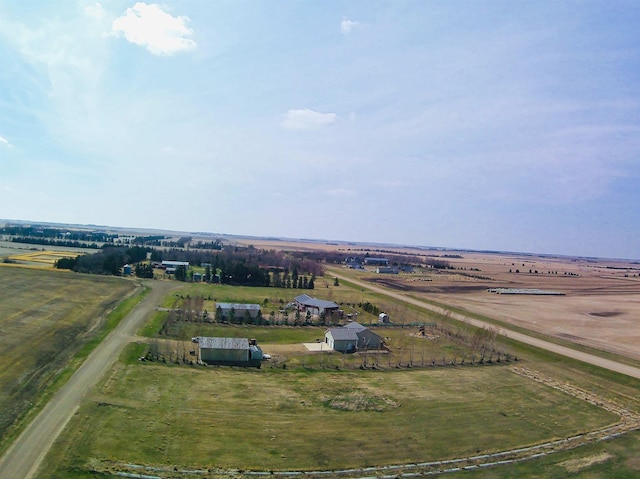 birds eye view of property featuring a rural view