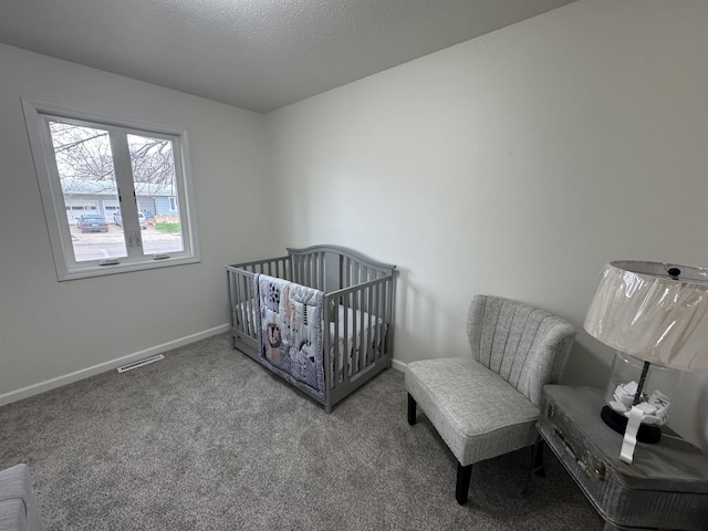 1331 4th St, Minot, ND 58701 - carpeted bedroom with visible vents and baseboards