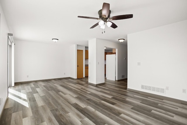 unfurnished living room with visible vents, baseboards, ceiling fan, and wood finished floors