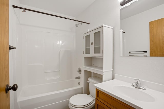 bathroom featuring vanity, shower / tub combination, and toilet
