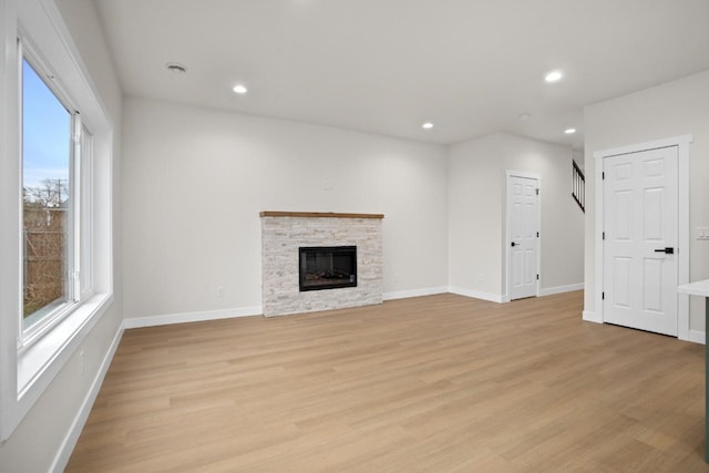 unfurnished living room with light wood-style floors, recessed lighting, and a healthy amount of sunlight