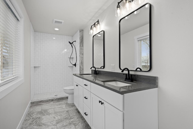 full bathroom with visible vents, a sink, marble finish floor, and toilet