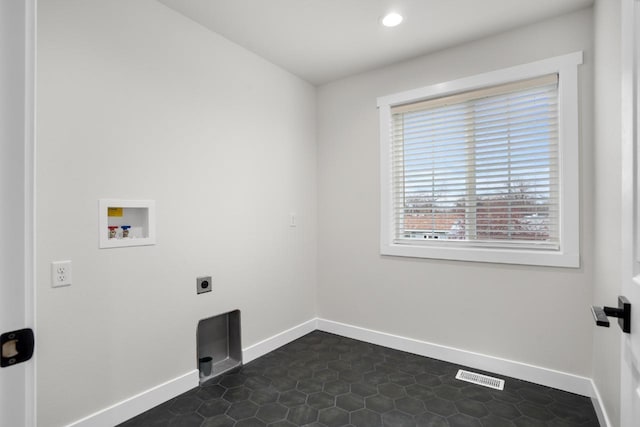 clothes washing area with laundry area, washer hookup, baseboards, hookup for an electric dryer, and visible vents