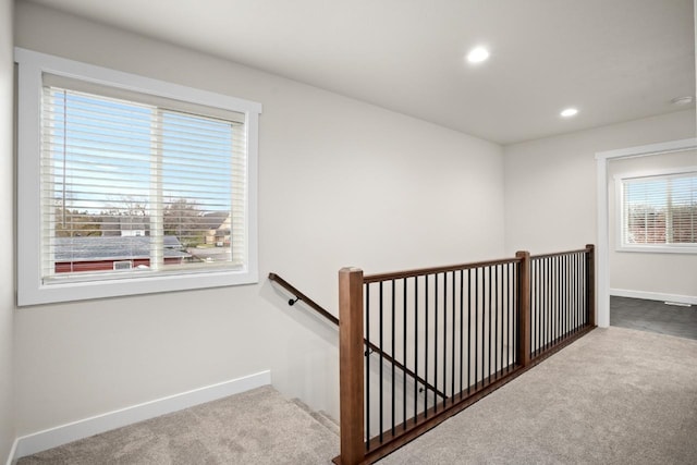 staircase featuring carpet flooring, recessed lighting, and baseboards