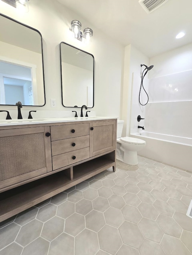 bathroom featuring shower / tub combination, a sink, double vanity, toilet, and visible vents