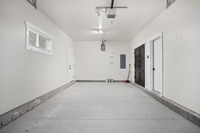 garage featuring a garage door opener and electric panel
