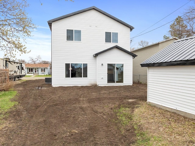 rear view of property featuring central air condition unit