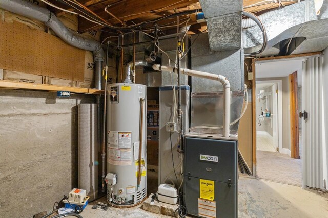utility room featuring gas water heater