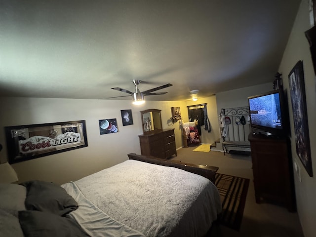 bedroom with carpet floors, a ceiling fan, and a closet