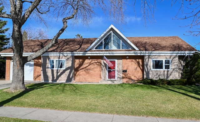 view of front of house featuring a front yard and brick siding