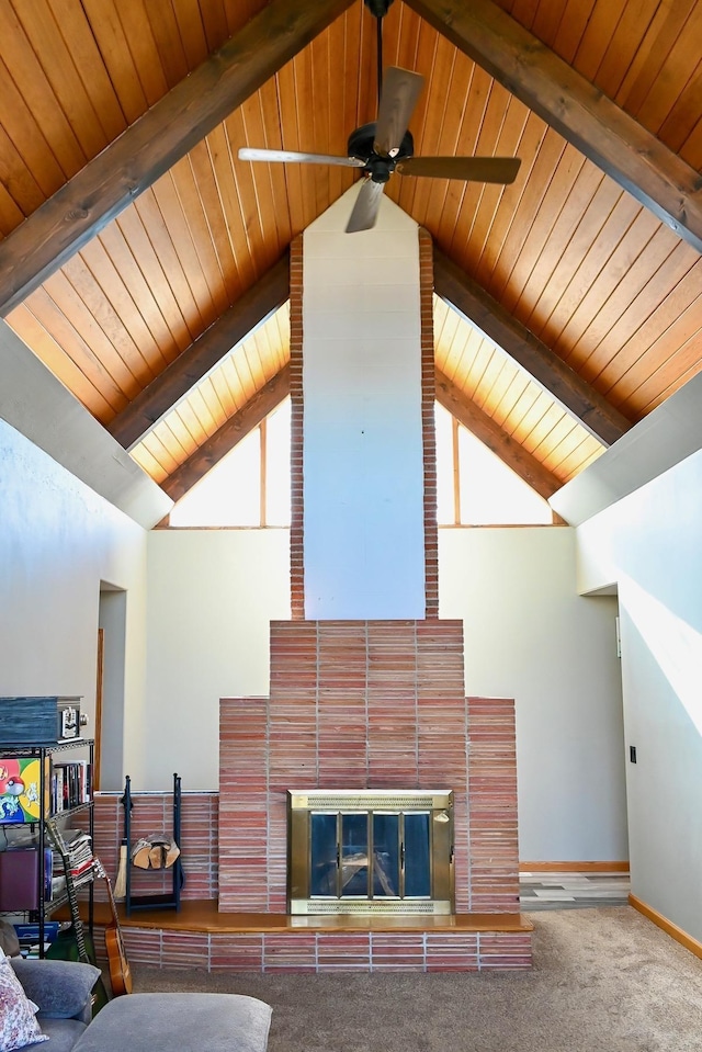living room featuring wooden ceiling, high vaulted ceiling, and beam ceiling