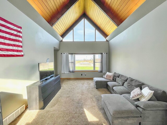 living room with wood ceiling, visible vents, high vaulted ceiling, carpet floors, and beamed ceiling