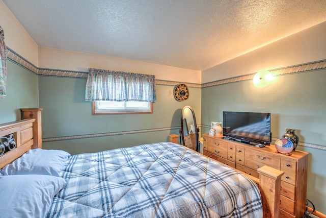 bedroom featuring a textured ceiling