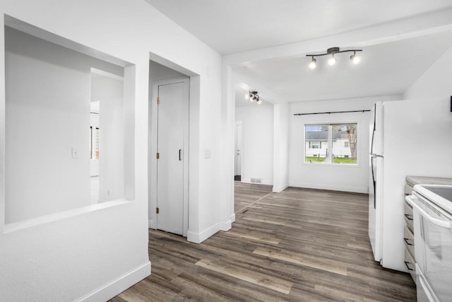 kitchen featuring white electric range oven, visible vents, baseboards, and dark wood-style floors