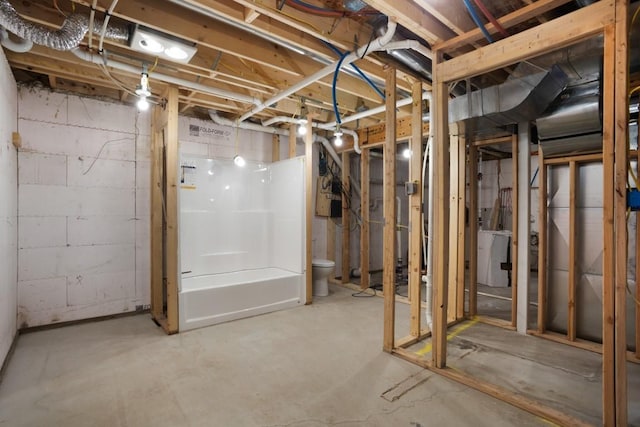 unfinished basement with washer / dryer