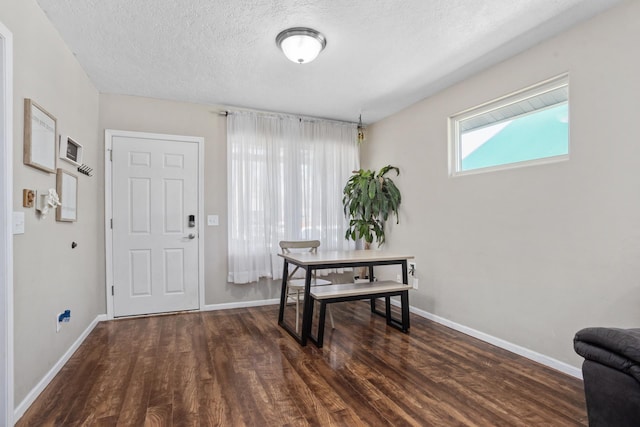 1019 7th Ave, Minot, ND 58703 - foyer with a textured ceiling, baseboards, and wood finished floors