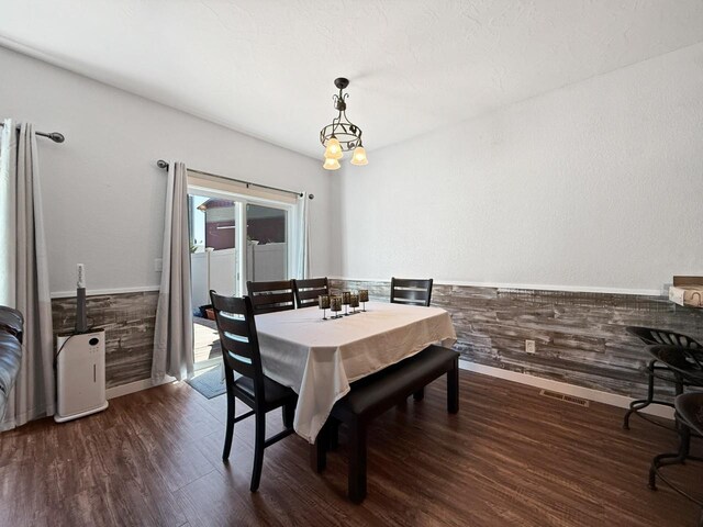 4005 Crossing St, Minot, ND 58701 - dining room with baseboards, visible vents, and dark wood finished floors
