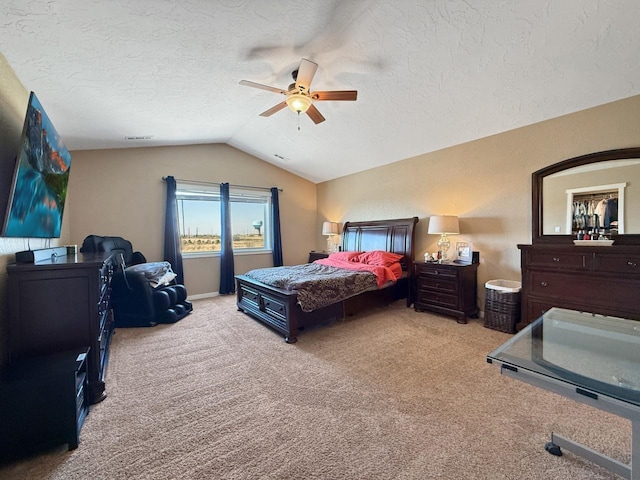 4005 Crossing St, Minot, ND 58701 - carpeted bedroom with a textured ceiling, vaulted ceiling, and ceiling fan