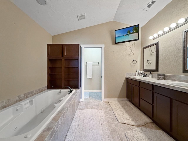 4005 Crossing St, Minot, ND 58701 - bathroom with a sink, lofted ceiling, a textured ceiling, and visible vents