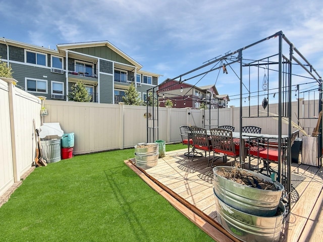 4005 Crossing St, Minot, ND 58701 - view of yard with outdoor dining area and a fenced backyard