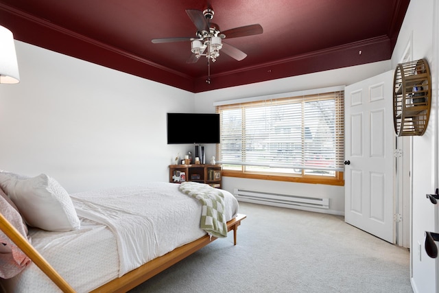 724 3rd Ave, Minot, ND 58703 - carpeted bedroom featuring crown molding, baseboard heating, and ceiling fan