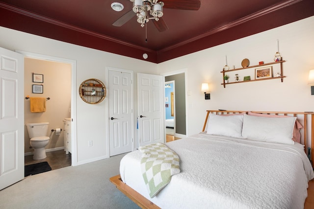 724 3rd Ave, Minot, ND 58703 - carpeted bedroom featuring ceiling fan, ensuite bathroom, baseboards, and ornamental molding