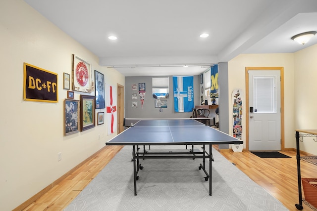 724 3rd Ave, Minot, ND 58703 - recreation room with recessed lighting, baseboards, and wood finished floors