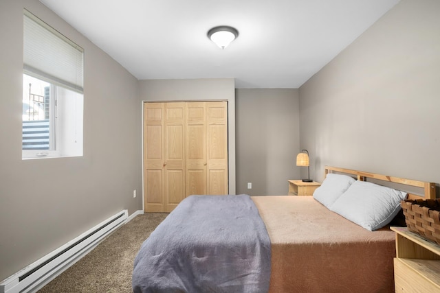 724 3rd Ave, Minot, ND 58703 - carpeted bedroom featuring a closet, baseboards, and a baseboard radiator