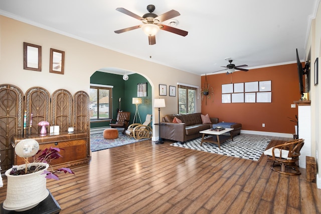 724 3rd Ave, Minot, ND 58703 - living area with ceiling fan, a wealth of natural light, wood finished floors, and arched walkways