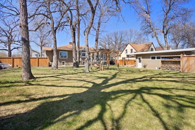 724 3rd Ave, Minot, ND 58703 - view of yard with a pergola and fence