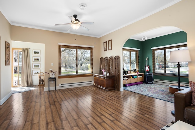 724 3rd Ave, Minot, ND 58703 - interior space with ceiling fan, hardwood / wood-style flooring, a baseboard heating unit, and arched walkways